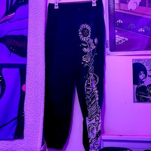 Pants with flowers and skeleton jar